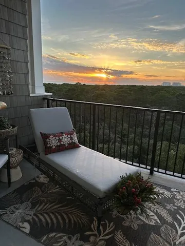 a view of a swimming pool and lounge chairs