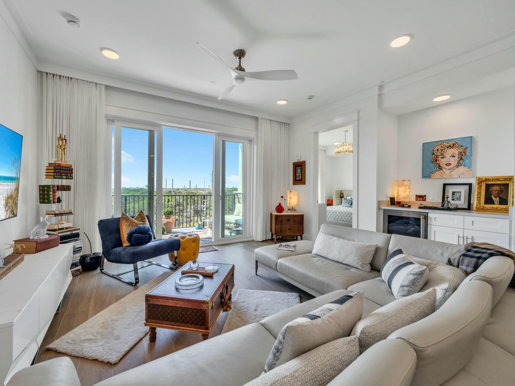 206 Henderson Resort Way, Unit 5202 Destin, FL 32541 - Photo 9 of 55 a living room with furniture and large windows