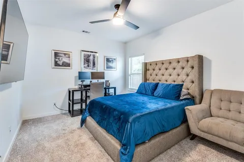 a bedroom with a bed and furniture