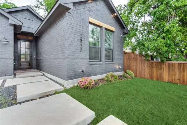 a backyard of a house with lots of green space