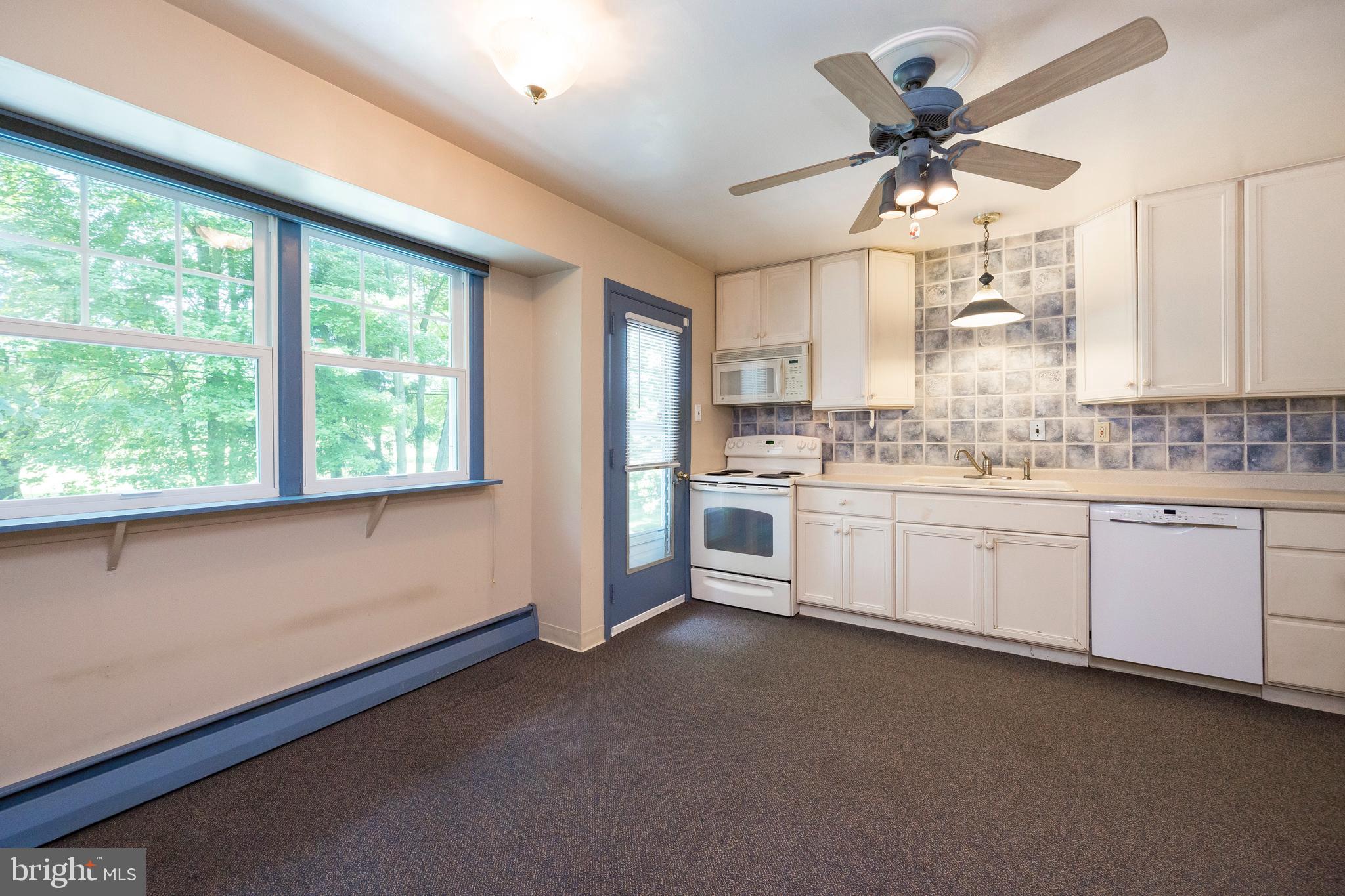 310 Llewellyn Road Ambler, PA 19002 - Photo 18 of 47 Kitchen with Door to Deck