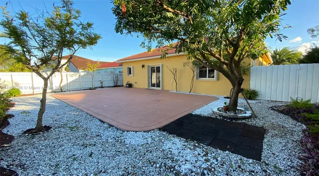 a house with trees in the background