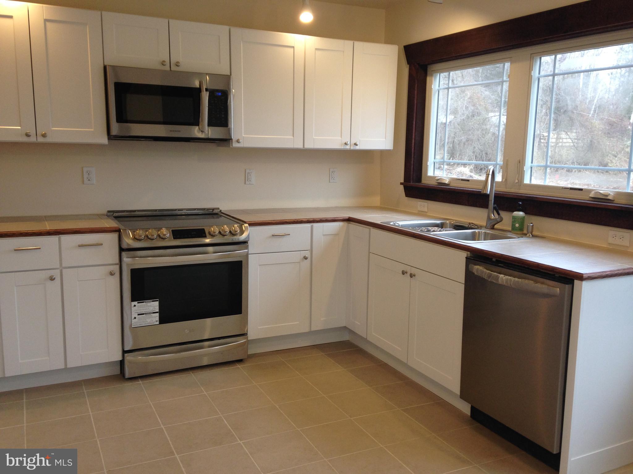 4485 Old Auburn Road Catlett, VA 20119 - Photo 2 of 5 a kitchen with a stove microwave and sink