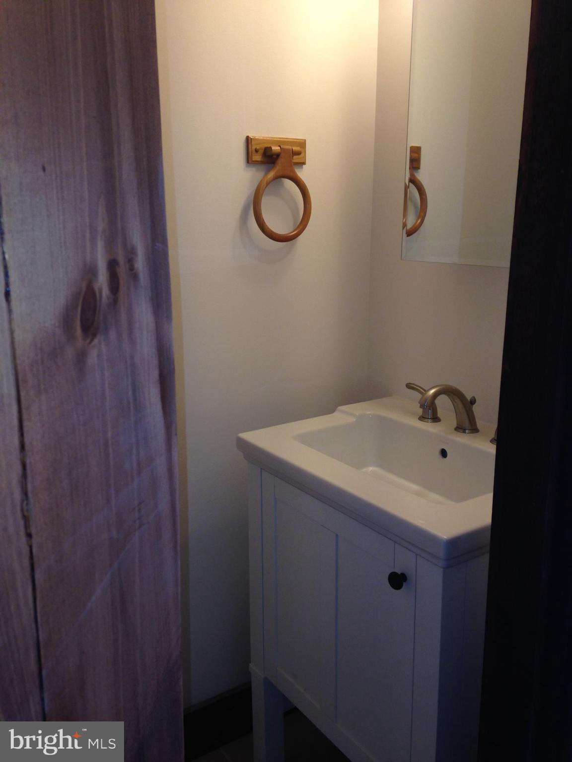 4485 Old Auburn Road Catlett, VA 20119 - Photo 5 of 5 a bathroom with a granite countertop sink and a mirror