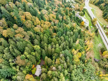 a view of a house with a tree