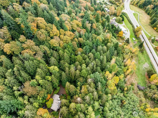 a view of a house with a tree