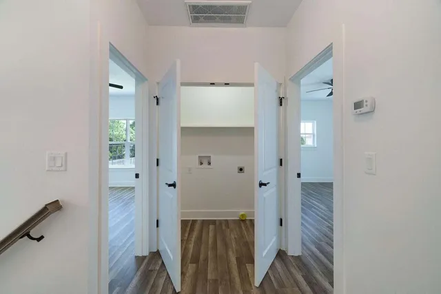 wooden floor with a bathroom