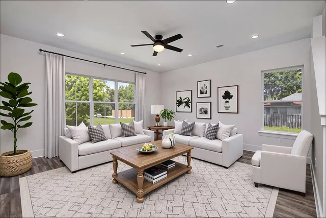 a living room with furniture and a large window