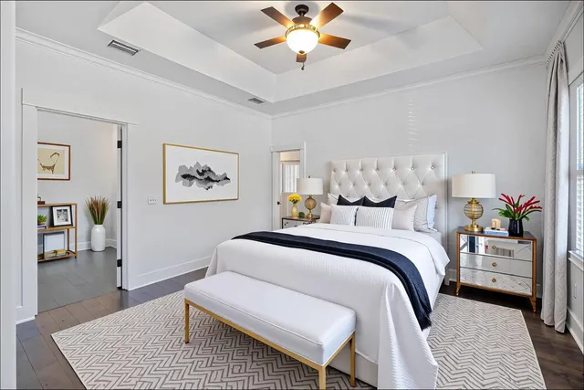 a spacious bedroom with a bed and a couch