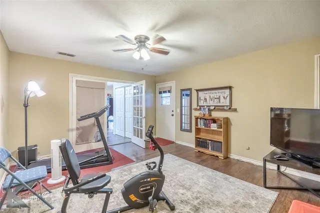 a view of a livingroom with furniture and a flat screen tv