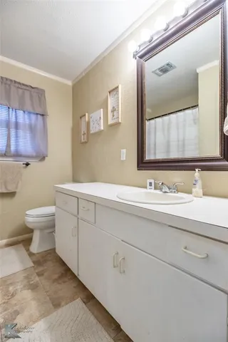 a bathroom with a sink and a toilet