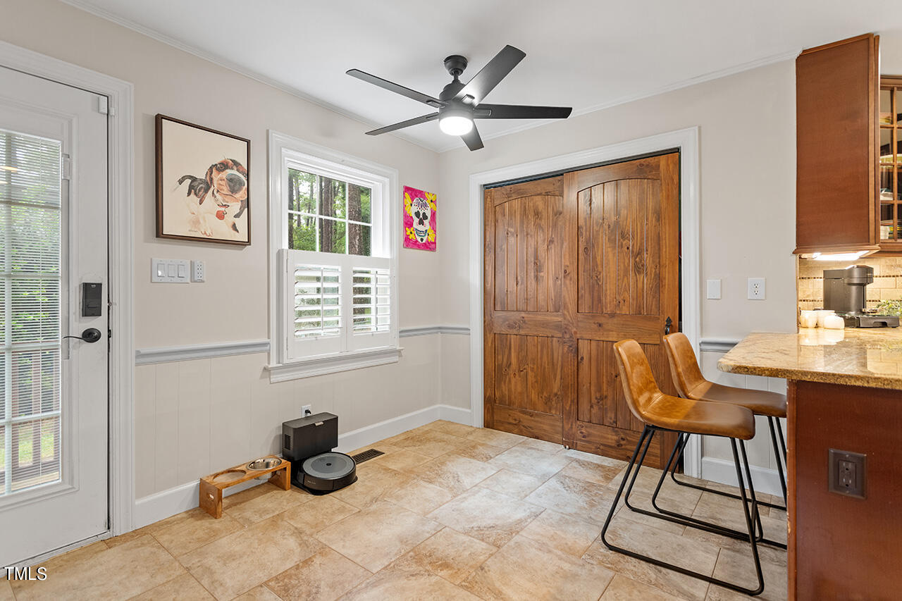 4918 Quail Hollow Drive Raleigh, NC 27609 - Photo 16 of 36 a room with table chairs and a window