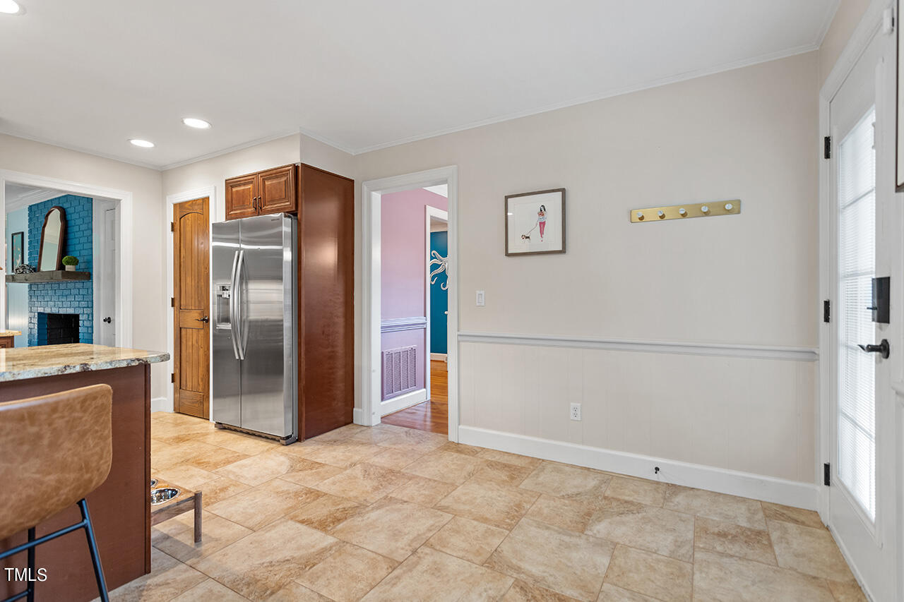 4918 Quail Hollow Drive Raleigh, NC 27609 - Photo 17 of 36 a view of kitchen with refrigerator and cabinets