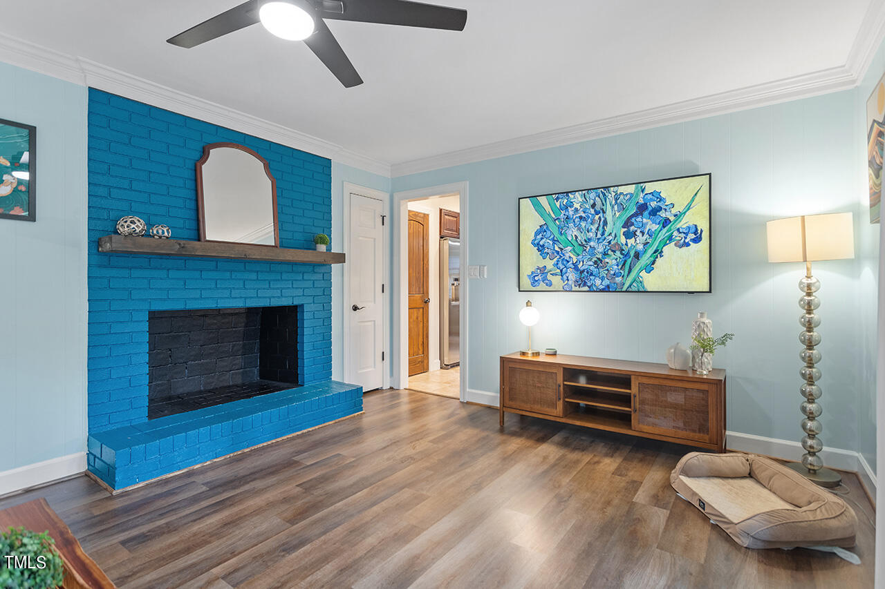 4918 Quail Hollow Drive Raleigh, NC 27609 - Photo 18 of 36 a living room with furniture and a fireplace