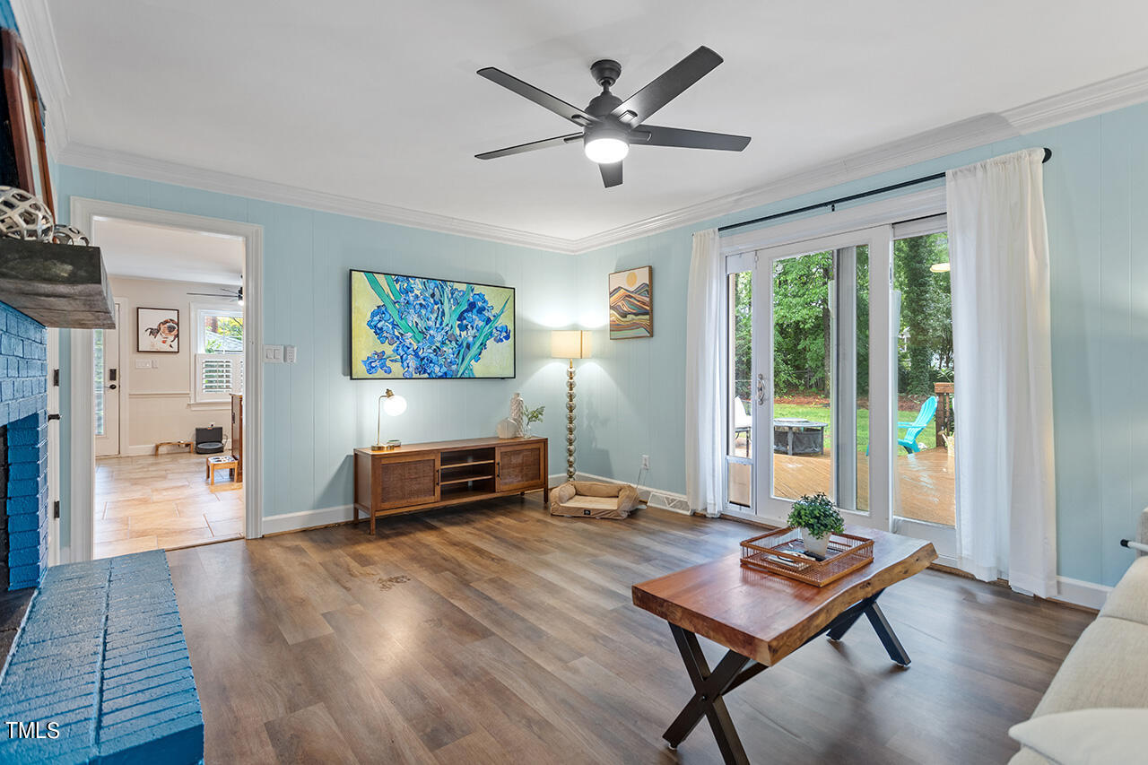 4918 Quail Hollow Drive Raleigh, NC 27609 - Photo 20 of 36 a living room with furniture and a wooden floor