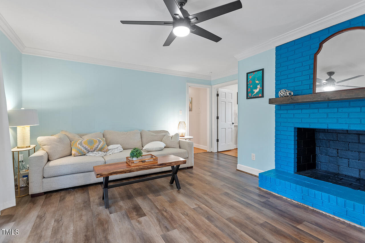 4918 Quail Hollow Drive Raleigh, NC 27609 - Photo 21 of 36 a living room with furniture and a fireplace