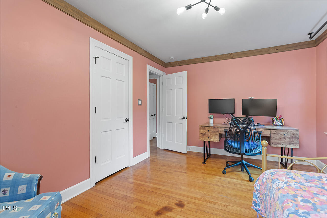 4918 Quail Hollow Drive Raleigh, NC 27609 - Photo 27 of 36 a workspace with furniture and wooden floor