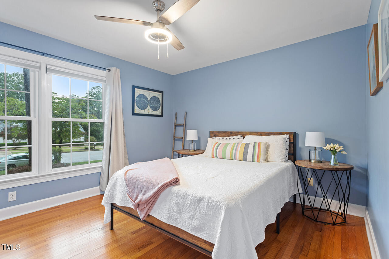 4918 Quail Hollow Drive Raleigh, NC 27609 - Photo 28 of 36 a bedroom with a bed and a table