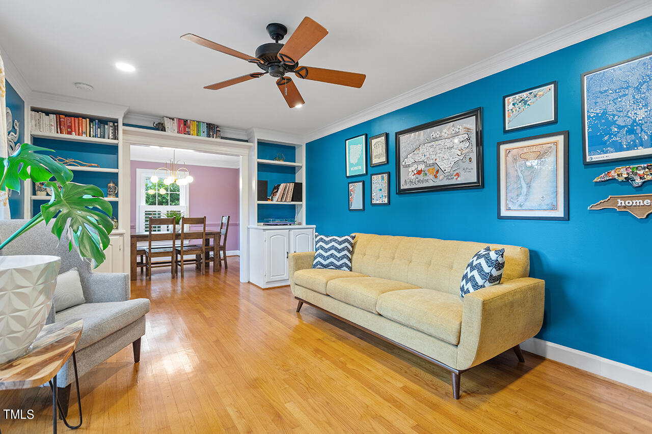 4918 Quail Hollow Drive Raleigh, NC 27609 - Photo 4 of 36 a living room with furniture and a large window