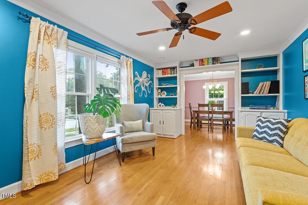 4918 Quail Hollow Drive Raleigh, NC 27609 - Photo 5 of 36 a living room with furniture and a large window