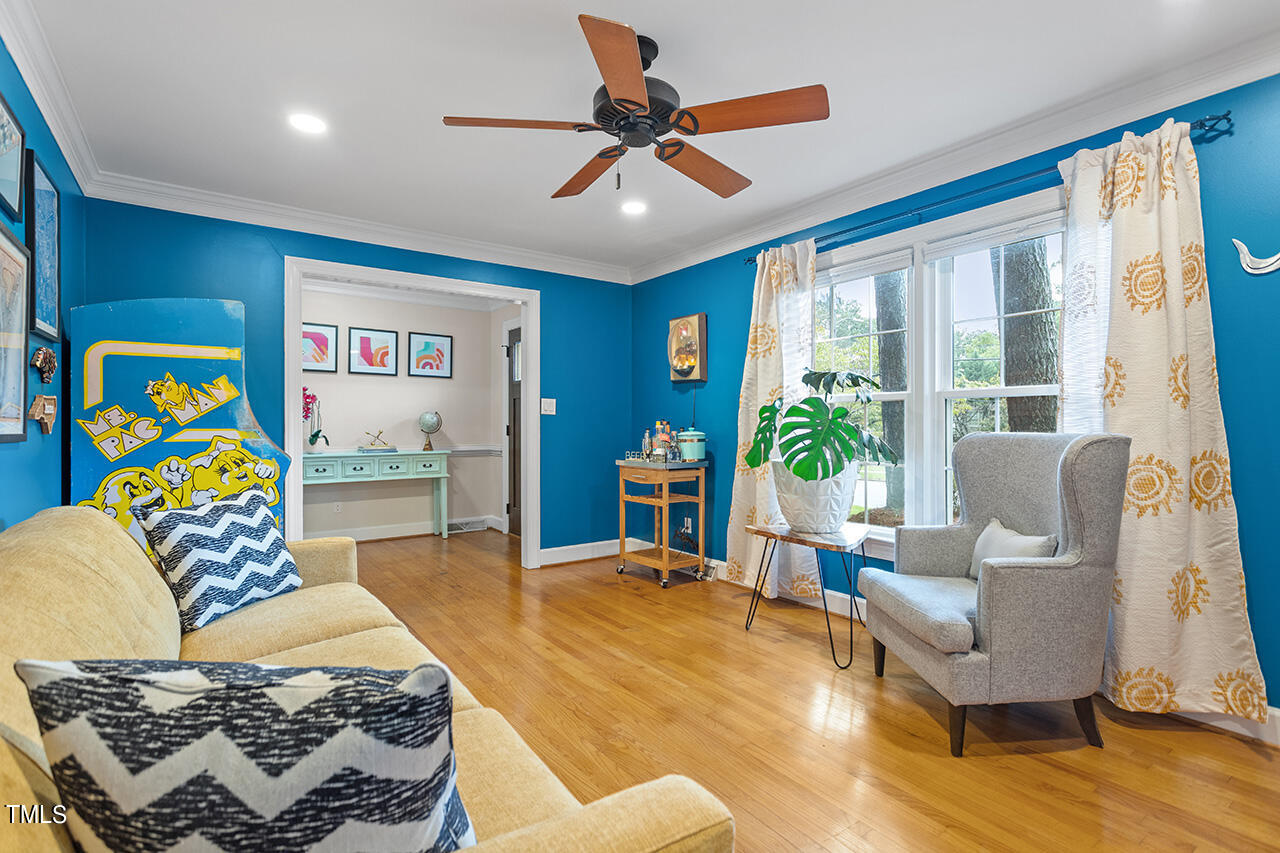 4918 Quail Hollow Drive Raleigh, NC 27609 - Photo 6 of 36 a living room with furniture and a potted plant