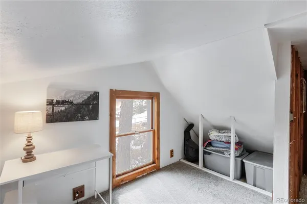 a workspace with furniture and window