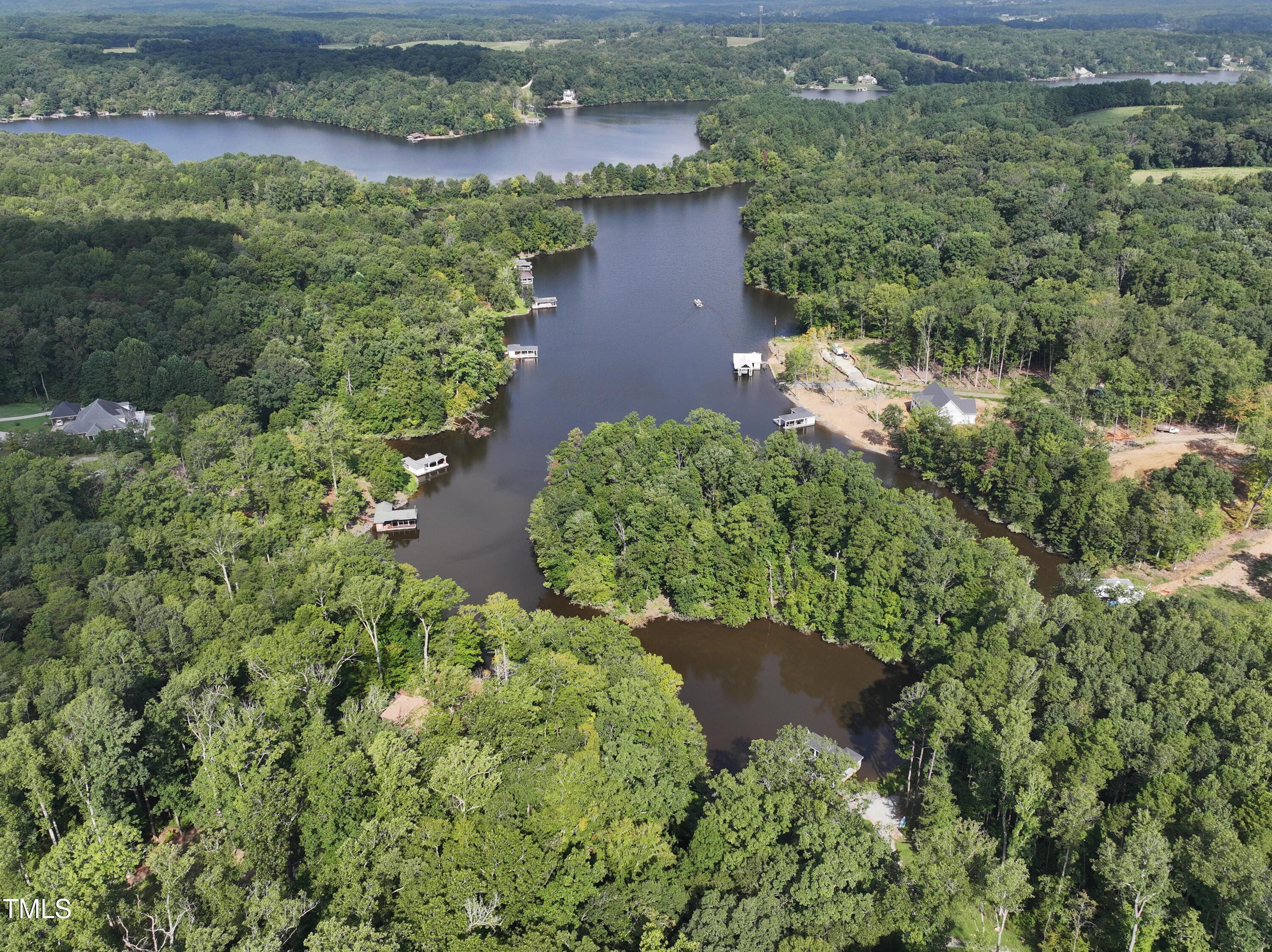 Lot 19 Ferncrest Court Roxboro, NC 27574 - Photo 4 of 11 an aerial view of a house with a yard and lake view