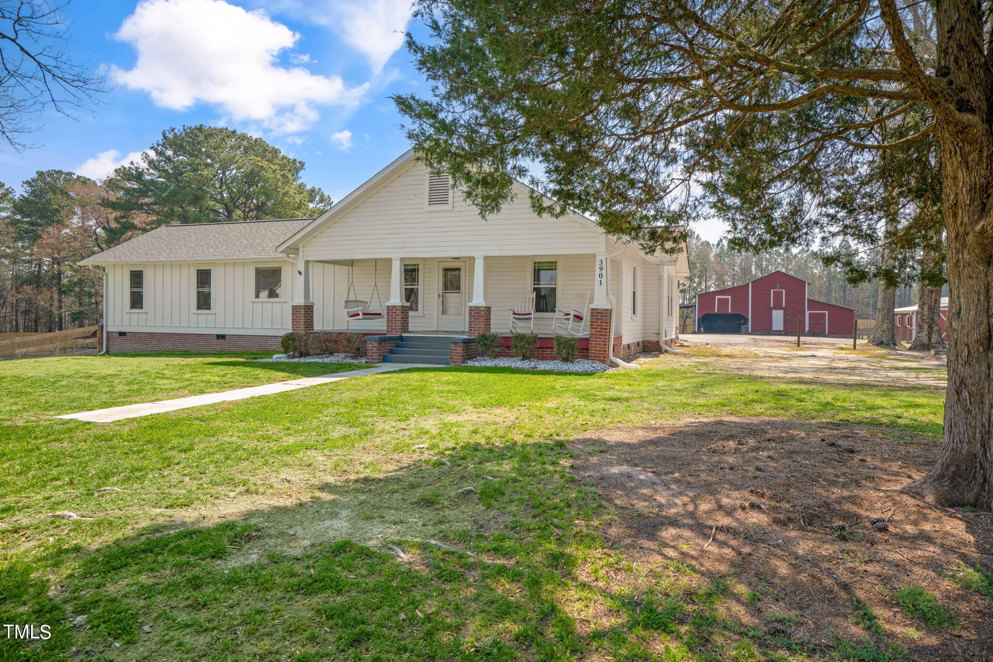3901 Bosco Road New Hill, NC 27562 - Photo 1 of 51 a house view with a sitting space and garden