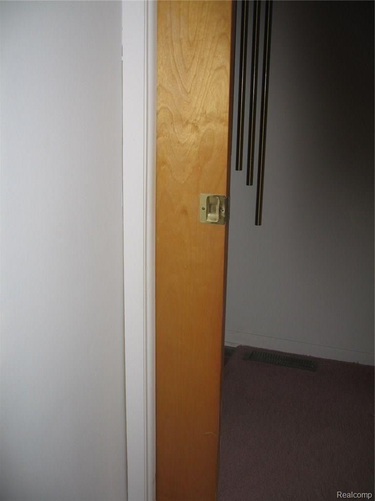 9025 East Potter Road Davison, MI 48423 - Photo 39 of 39 Pocket door for bedroom hallway