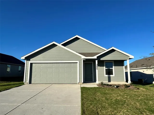 a front view of a house with yard