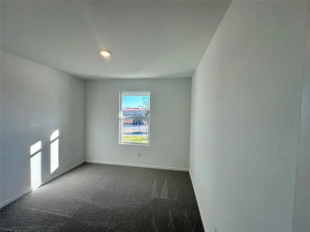 a view of an empty room and window