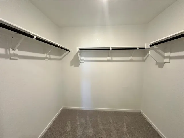 a bathroom with a sink toilet tub vanity and shower