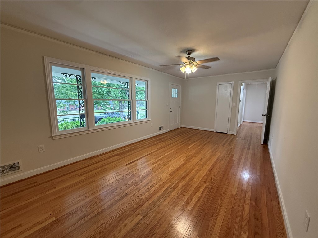 2304 Poplar Lane Anderson, SC 29621 - Photo 6 of 33 This living area features rich hardwood floors and abundant natural light.