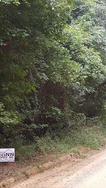 698 Comer Road Gray, GA 31032 - Photo 2 of 2 a sign that is on a road