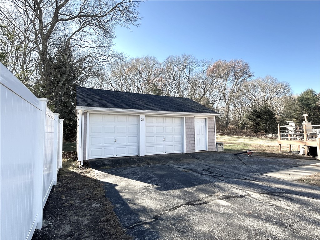 83 Old Post Road Westerly, RI 02891 - Photo 3 of 28 2 car deep garage with storage and work bench