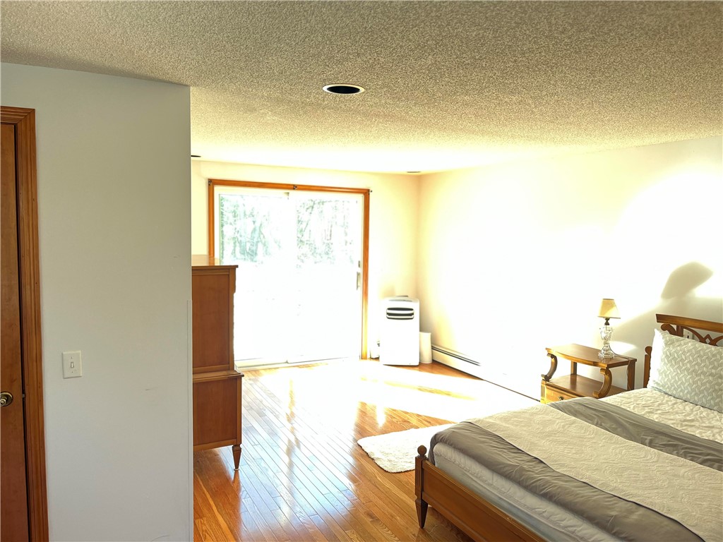 83 Old Post Road Westerly, RI 02891 - Photo 10 of 28 Primary bedroom has double sliders to private south facing deck