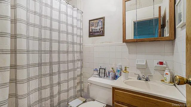 a bathroom with a sink and a shower curtain