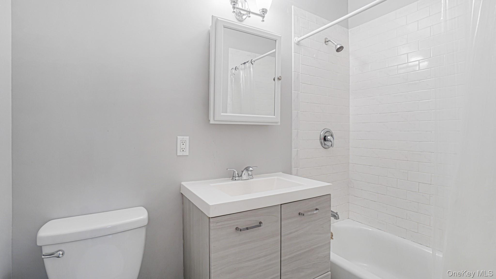 1270 Rosedale Avenue Bronx, NY 10472 - Photo 18 of 19 a bathroom with a sink a toilet and shower