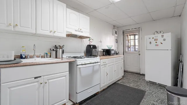 a kitchen with sink cabinets and window