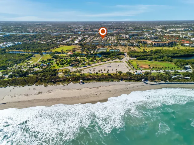 an aerial view of a residential houses with outdoor space