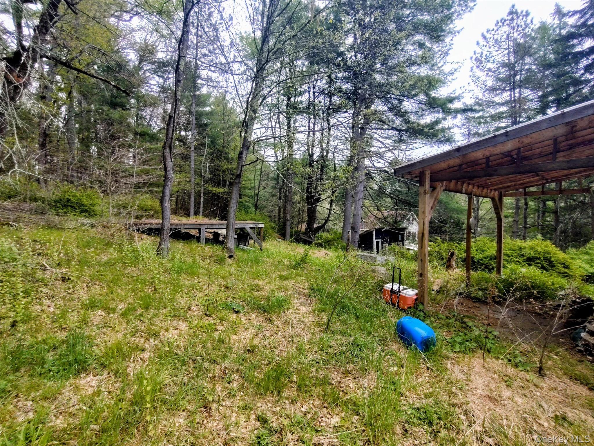 174 Forestburgh Road Forestburgh, NY 12777 - Photo 10 of 28 a view of a chair and table in the garden