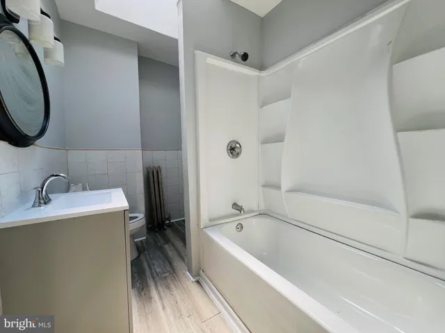 a bathroom with a sink a toilet and a bathtub