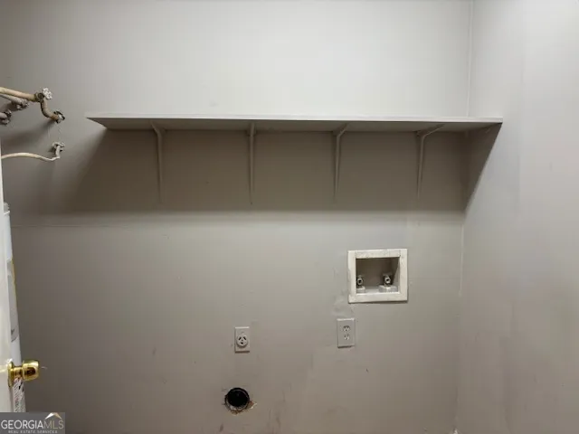 a kitchen with a sink and a refrigerator