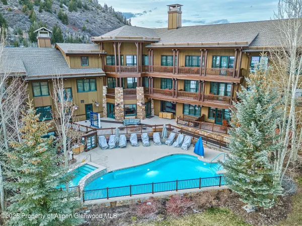 a living room with furniture fireplace and flat screen tv