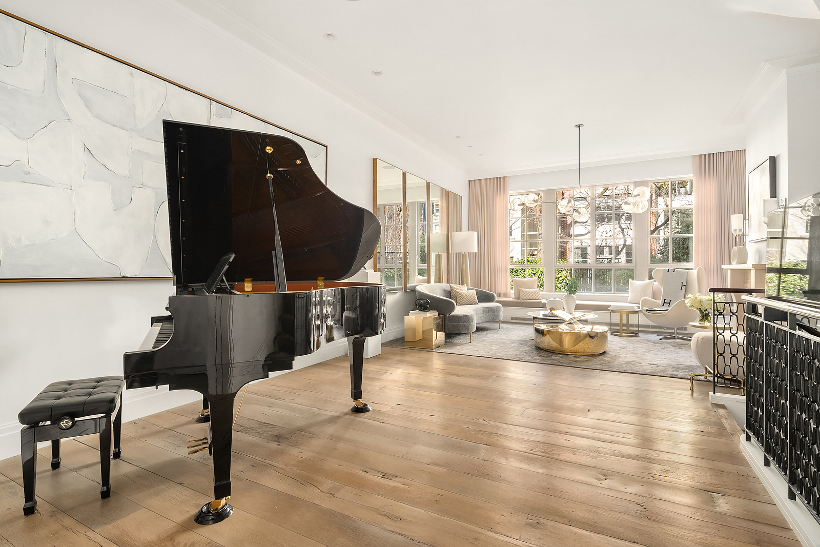 163 East 82nd Street Manhattan, NY 10028 - Photo 1 of 1 a living room with furniture and a large window
