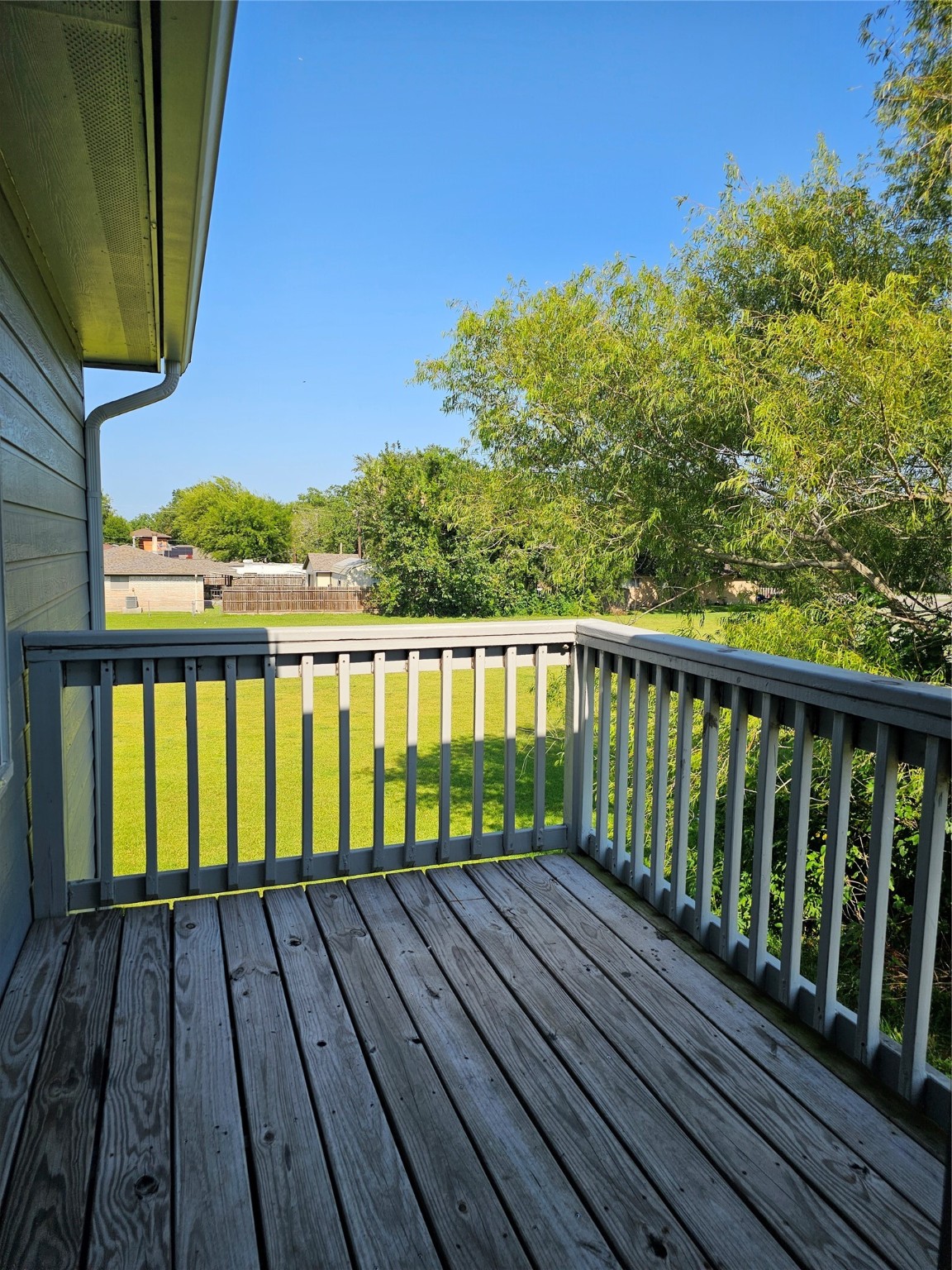 4426 25th Street East, Unit C Dickinson, TX 77539 - Photo 13 of 31 a view of balcony with wooden floor and fence
