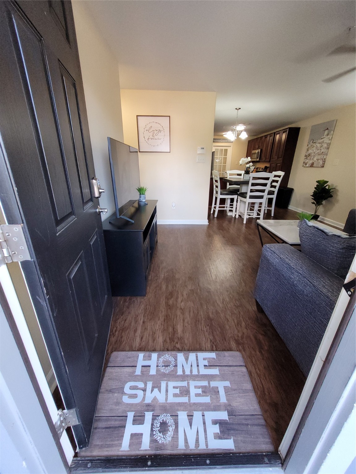 4426 25th Street East, Unit C Dickinson, TX 77539 - Photo 31 of 31 a living room with furniture and a rug