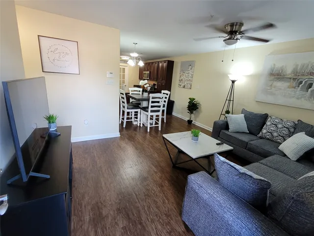 a living room with furniture and a rug