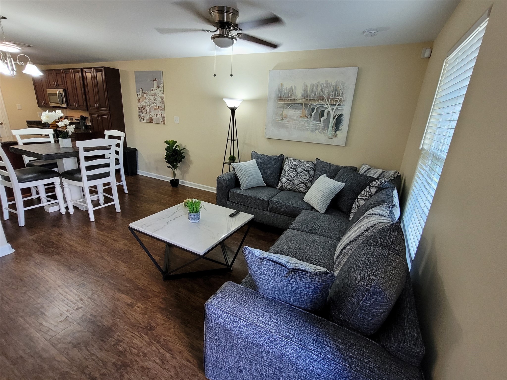 4426 25th Street East, Unit C Dickinson, TX 77539 - Photo 17 of 31 a living room with furniture and wooden floor