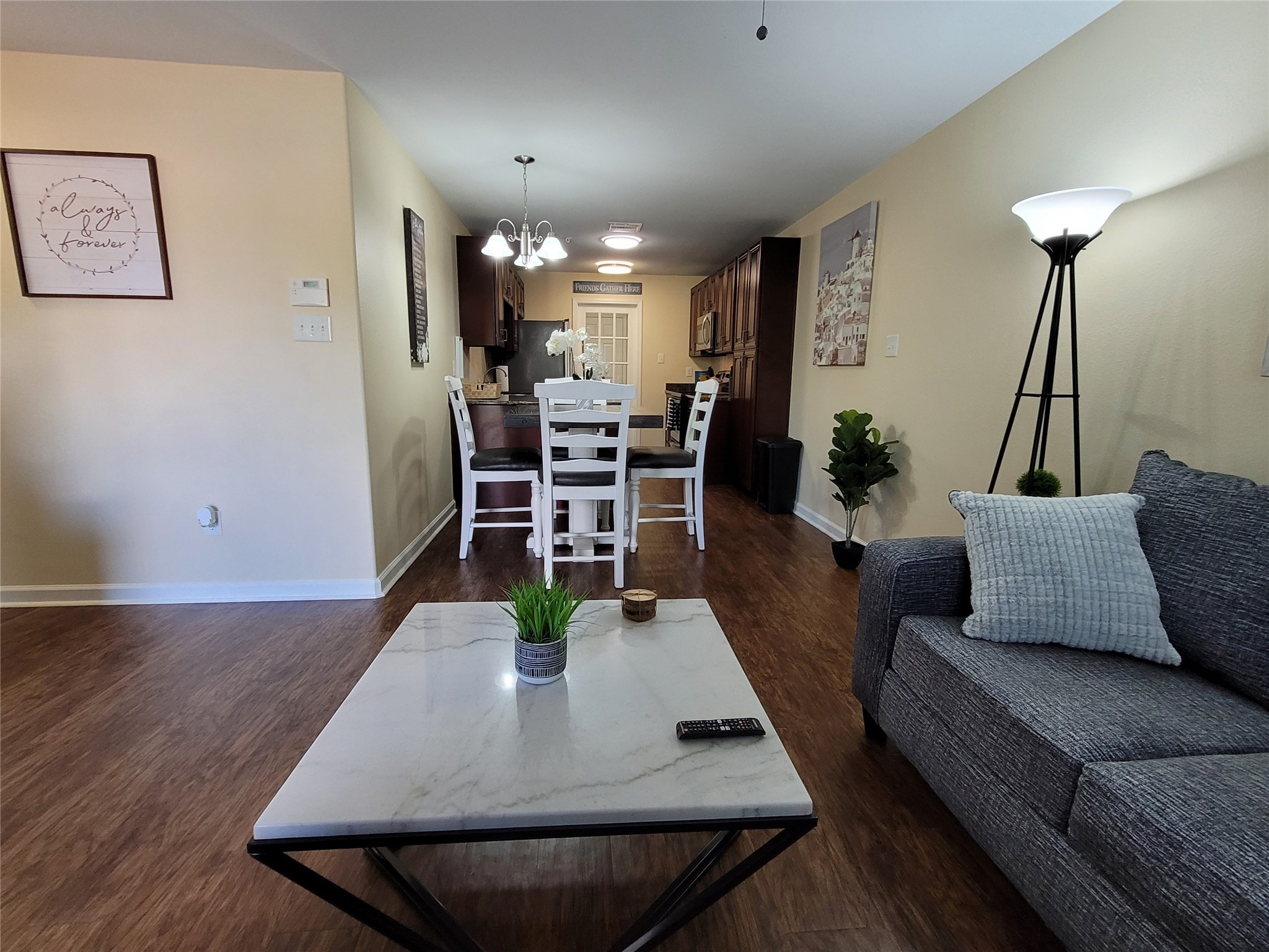 4426 25th Street East, Unit C Dickinson, TX 77539 - Photo 19 of 31 a living room with furniture and wooden floor